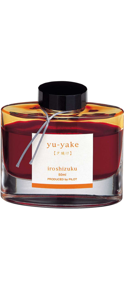 Iroshizuku Ink 50ml Bottle in yu-yake color, showcasing Japanese craftsmanship and vibrant hues available at a stationery store.