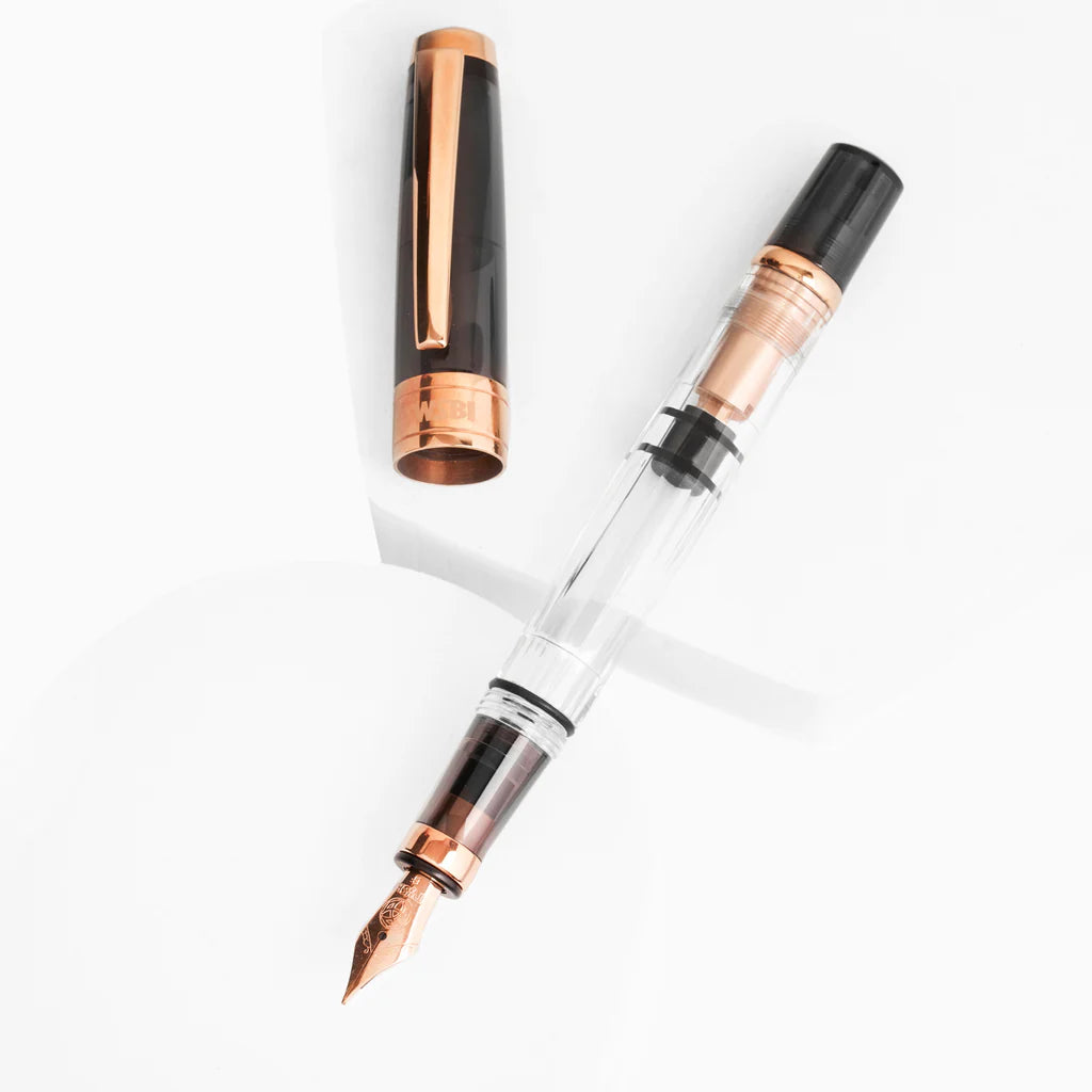 TWSBI Diamond 580 Smoke RG II Fountain Pen with rose gold accents, available at stationery store.