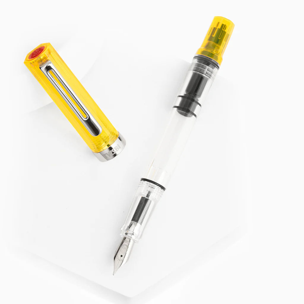 TWSBI ECO Transparent Yellow Fountain Pen with cap, ideal for stationery store enthusiasts, showcases vibrant color and piston-filling system.