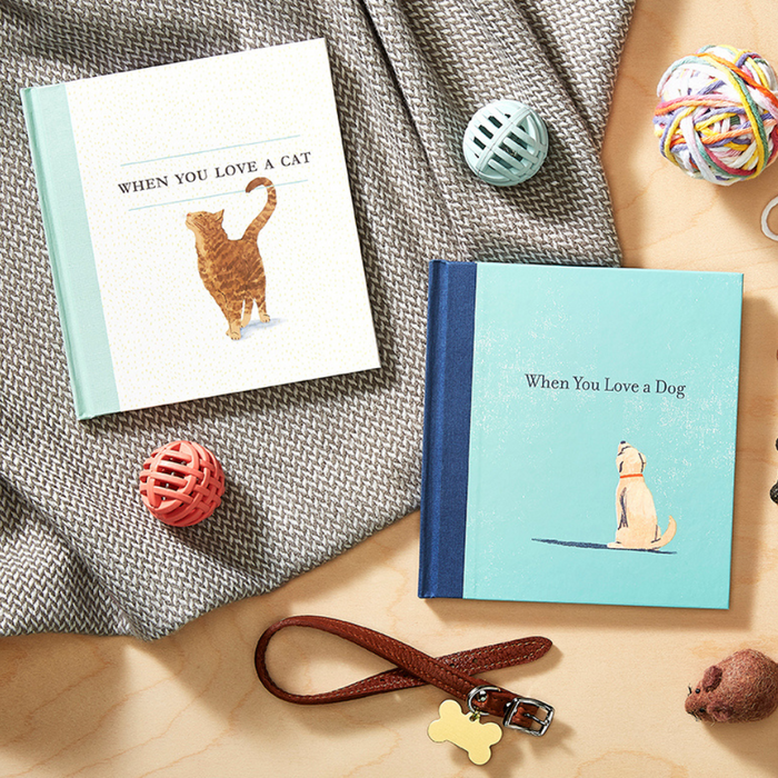 Alt Tag: Books "When You Love a Cat" and "When You Love a Dog" on a table, available at our stationery store.