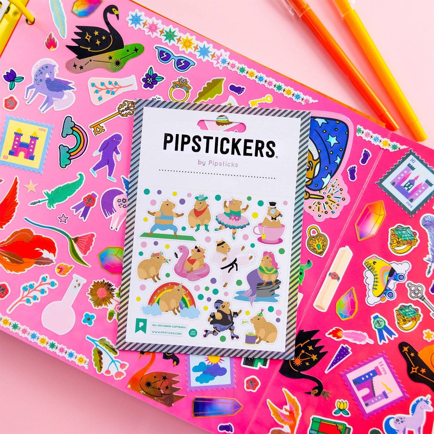 Colorful All-Occasion Capybara PipStickers with holographic accents, perfect for stationery store enthusiasts on pink backdrop.