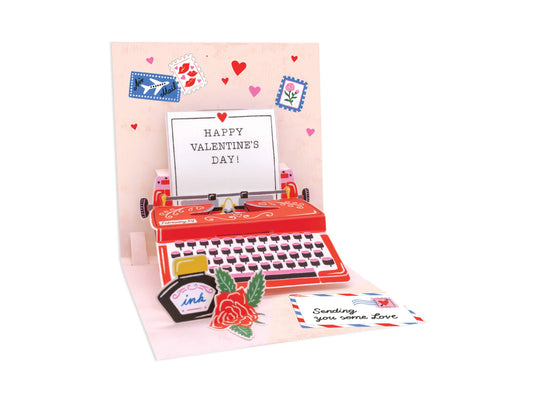 Just My Type Pop-Up Card with red typewriter design, colorful stationery details, and Valentine's message. Available at stationery stores.