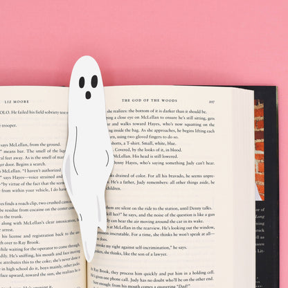 A ghost bookmark sticking out of a book, double-sided UV print on sturdy paper stock. Available at stationery store.