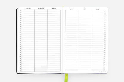 Open Daily Planner - Undated - Cosmic Blue, featuring blank monthly pages for goal setting and organization. Available at our stationery store.