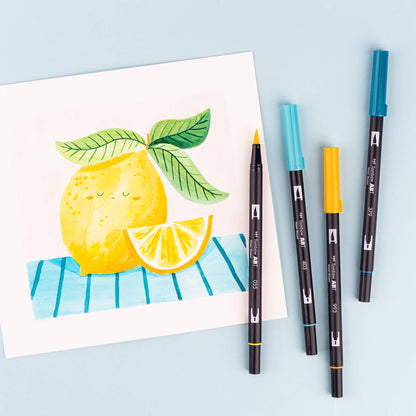 Dual Brush Pen Art Markers Lemon Squeezy 6-Pack for artists with watercolor lemon artwork, ideal for stationery store.