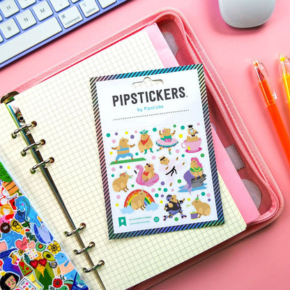 All-Occasion Capybara PipStickers with holographic foil on notebook in stationery store setting