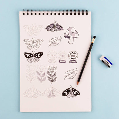 Tombow Drawing Set with notepad featuring doodles, pencil, and eraser, available at stationery store.