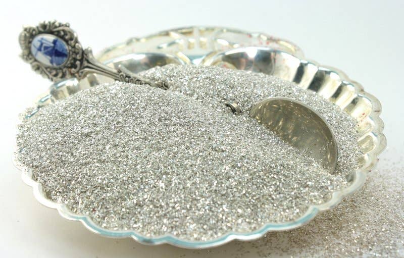 Silver Sparkly German Glass Glitter in a decorative dish, perfect for stationery stores looking for a vintage touch with fine 90 grit quality.