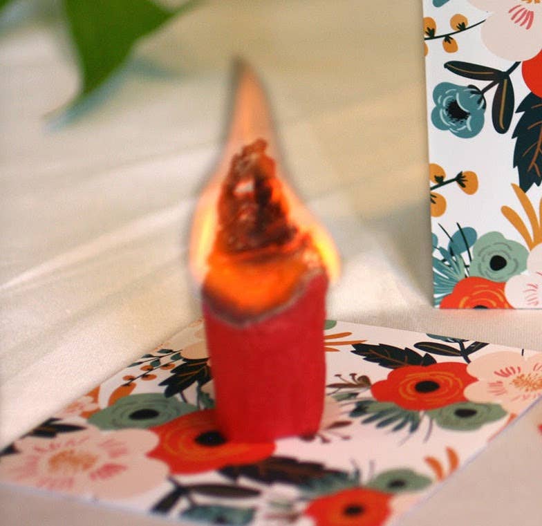 Floral-themed stationery with a lit candle from Almond Blossoms Mini Kit, available at stationery store.