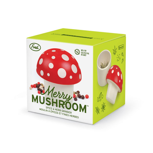 Fred's Merry Mushroom herb grinder in a colorful gift box, ideal for stationery store displays and spice grinding enthusiasts.