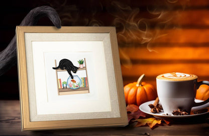 Quilled Mischievous Cat greeting card from stationery store, featuring a black cat with a fish bowl, framed on an autumn-themed table.