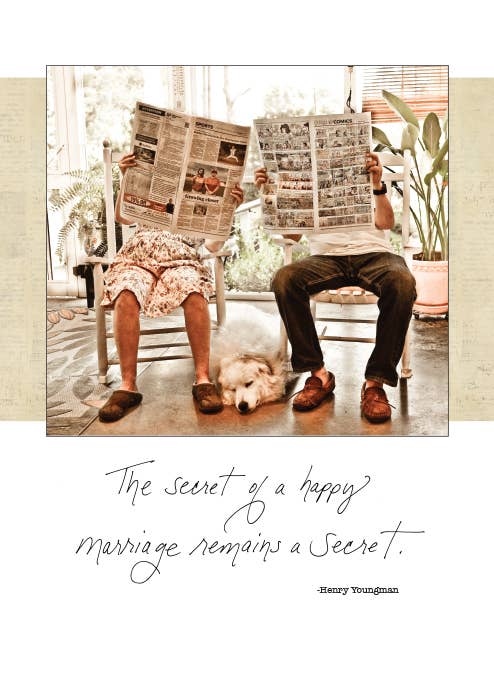 Couple reading newspapers with dog on anniversary card - the secret of a happy marriage remains a secret. Available at stationery store.