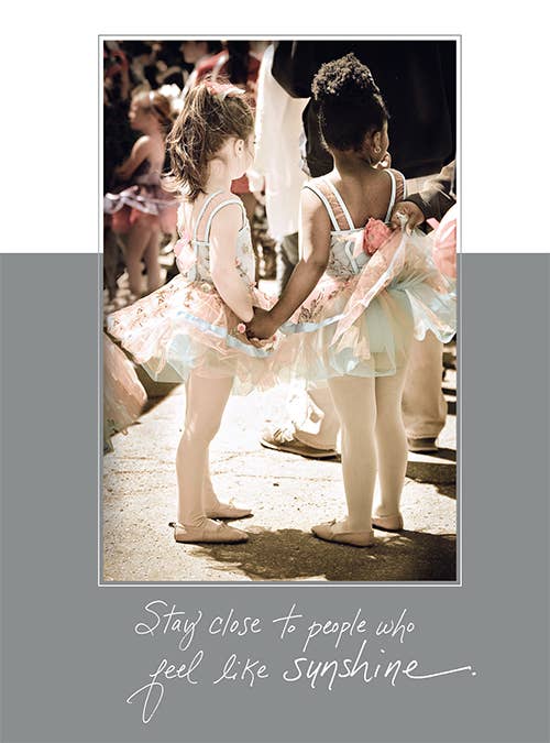 Greeting card titled 'Stay Close to People Who Feel Like Sunshine' featuring two children. Available at stationery store. Happy Birthday message inside.