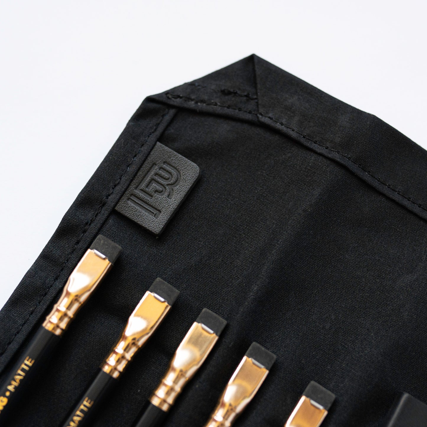 Blackwing Pencil Case in black canvas with pencils, available at stationery store.