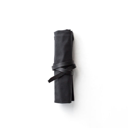 Blackwing Pencil Case in black canvas, rolled and tied, available at stationery store.